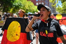 Indigenous people take part in an "Invasion Day" protest on Australia Day in Sydney on January 26, 2022. © 2022 STEVEN SAPHORE/AFP via Getty Images