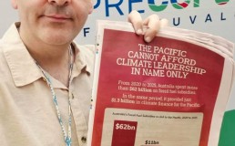 Photo of man holding statement of Pacific Elders' Voice
