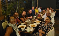DTP alumni with Patrick Earle, Clare Sidoti, Surya Deva and Joshua Cooper sitting around dinner table in Suva. Credit: Surya Deva