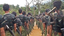 Arakan Army recruits scale climbing ropes at their Laiza, Kachin state, base camp. Credit: Voice of Amercia/Wikimedia Commons