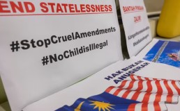 Banners and signs at a press conference in Kuala Lumpur on Nov 7, 2023. Rights groups have called for the Malaysian government to fulfill their promises to mothers of overseas-born children and withdraw certain amendment of the Federal Constitution on citizenship rights. Credit: CNA/Fadza Ishak