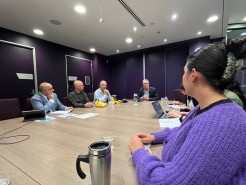 Justice Hari Phuyal with attendees of the Brown Bag lunch. Credit: DTP