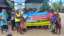 Photo of villagers campaigning against deep sea mining. Credit: Jonathan Mesulam