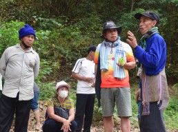During a tour of the Yuam River, Singkarn Ruenhom explains how the sediment in the river would be changed by the dam, harming species living there, March 12, 2023. Credit: RFA