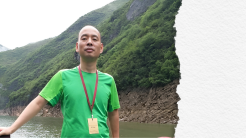 Photo of Lu Siwei in front of a river with mountain in the background. Credit: FORUM-ASIA