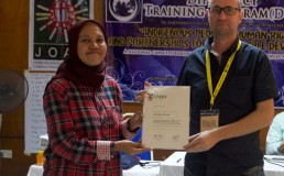 Matthew Coghlan receiving a trainer certificate during a DTP program. Credit: DTP