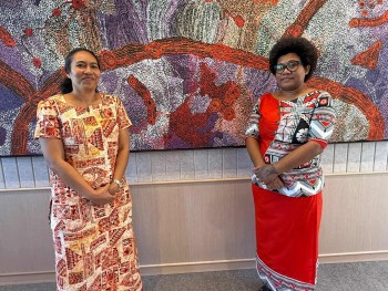 Melaia Kubuabola and Milika Baukitoga in front of Aboriginal painting while in Sydney for the Pacific Voices on Climate Change progra,. Credit: Melaia Kubuabola