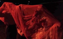 Performance from 8 August 2023 where performers danced under a red transculent cloth, which symbolised the "bloody trap" that Myanmar people have been living under since the 2021 coup. Photo: August Lynn