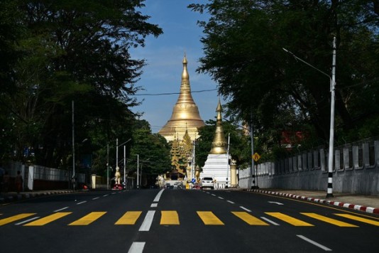 A nearly empty street near the Shwe Dagon Pagoda during a "silent strike" to protest and to mark the third anniversary of the military coup in Yangon on Feb. 1, 2024. Credit: AFP