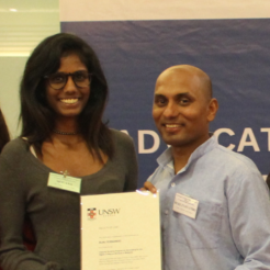 Photo of Ruki Fernando receiving certificate from a participant. Credit: DTP
