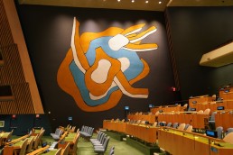 The Fernand Leger murals in the General Assembly Hall as Werner Schmidt of the United Nations discusses artworks at The United Nations in New York. Credit: AFP