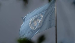 UN flag on a flag pole. Credit: UN Photo/Mark Garten  UN