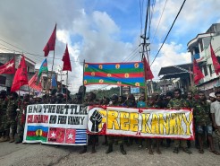 West Papuans rally in street holding signs saying Free Kanaky in Jayapura west Papua. Credit: Rudi Kogoya