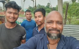Photo of Rejimon Kuttappan with North Indian workers in a South Indian coastal village at the end of 2024. Credit: Rejimon Kuttappan