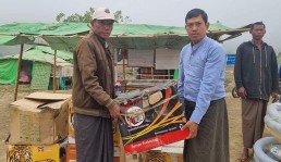 Wai Hun Aung (right) and his charity donate water pumps to drain seawater out of flooded ponds in Cyclone Mocha-affected areas in Rakhine State Credit: The Irrawaddy