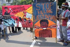 Papuan activists displaying banners during a rally commemorating the 61st anniversary of the failed efforts of Papuan tribal chiefs to declare independence from Dutch colonial rule in 1961 in Jakarta, Indonesia , Dec 1 2022. Credit: AP Photo/Tatan Syuflana